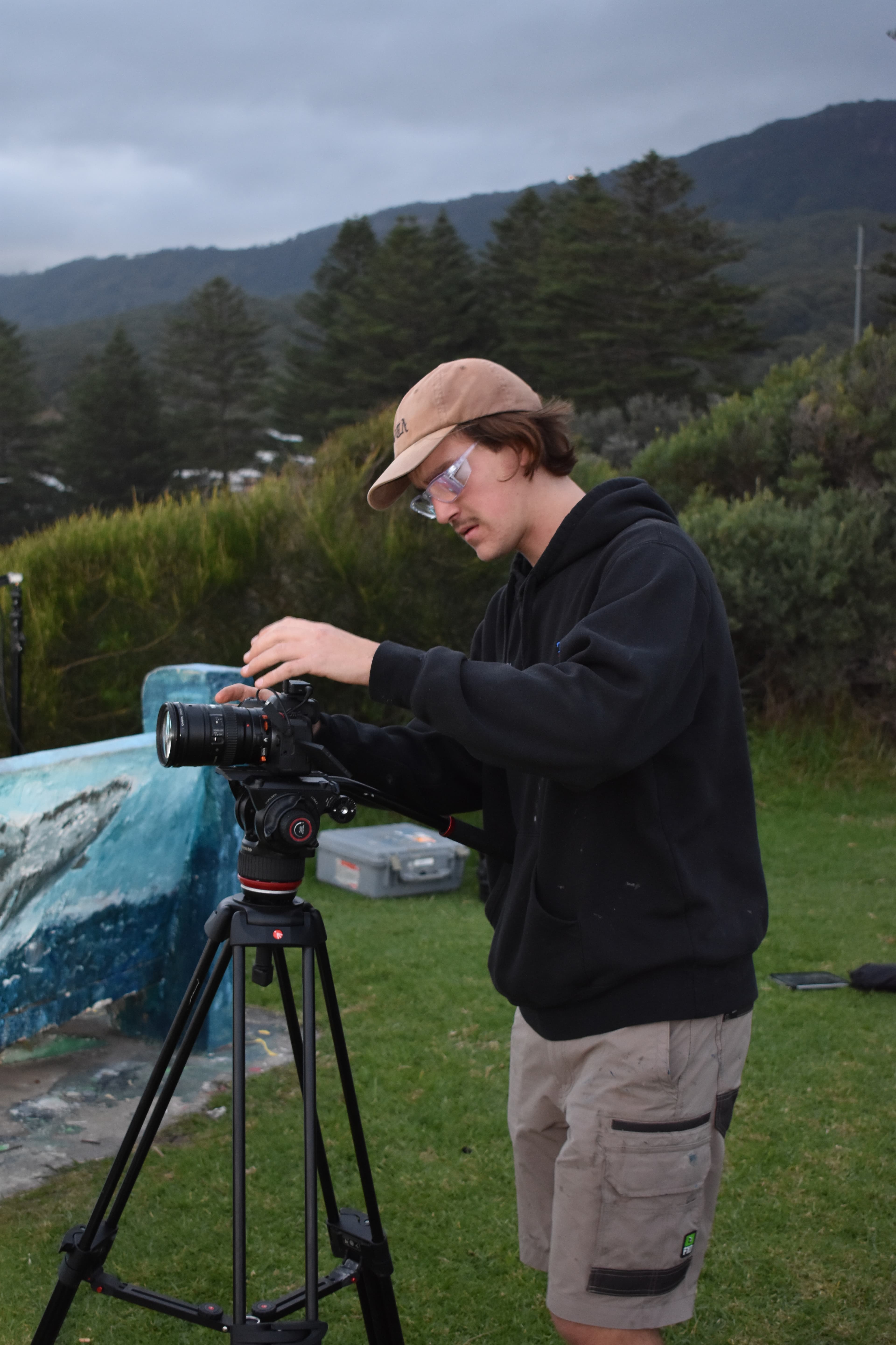 Denim Budai operating a camera on set